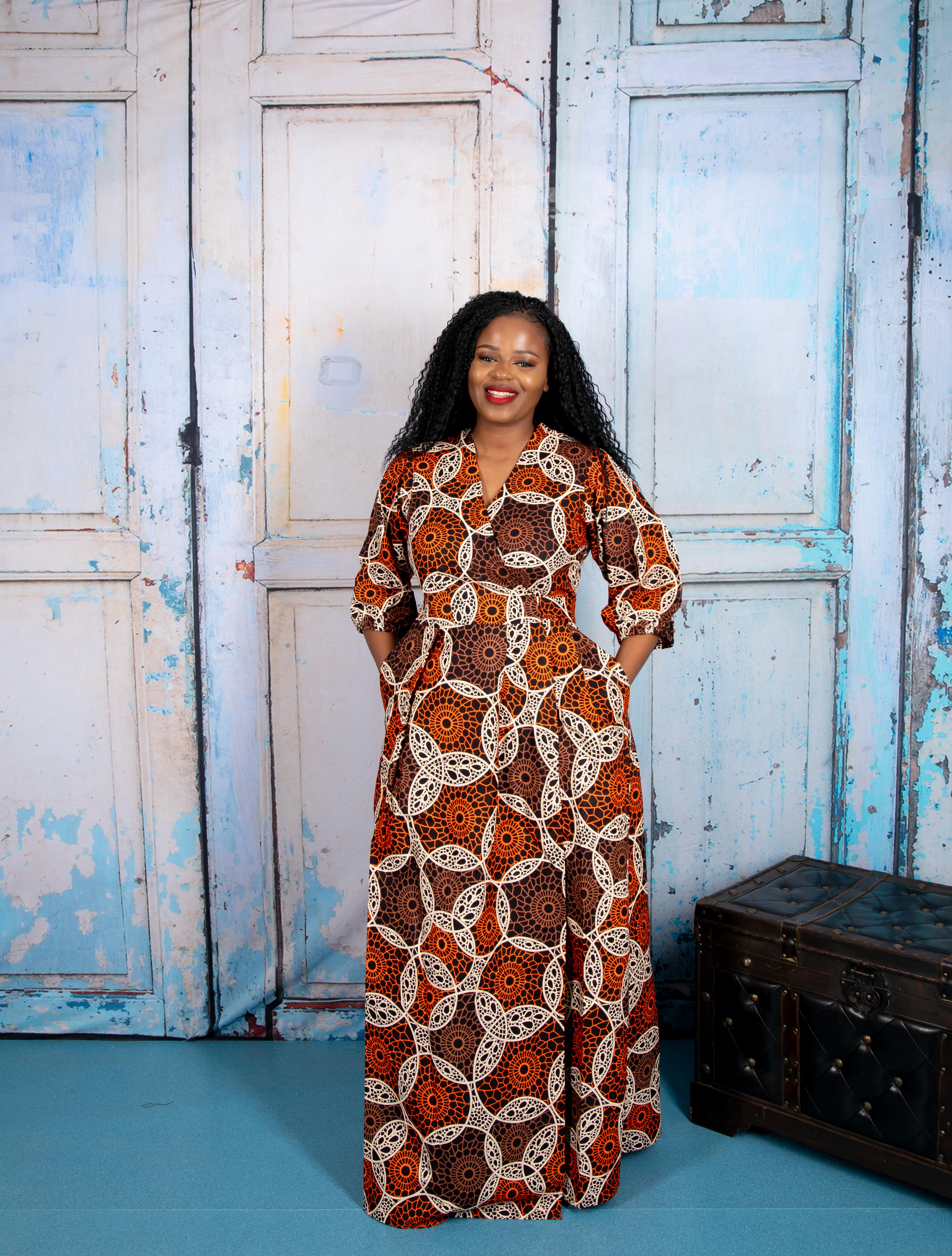 temad collections wrap dress, orange wrap dress, african print wrap dress, brown ankara wrap dress, african print midi dress, orange african print maxi dress, african print floor length dress, african print short sleeves dress, african print wrap maxi dress, ankara green wrap dress, ankara maxi wrap dress, modern african print dress, stylish wrap dress, maxi african print dress, puff sleeves wrap dress, long african print dress, long ankara wrap dress