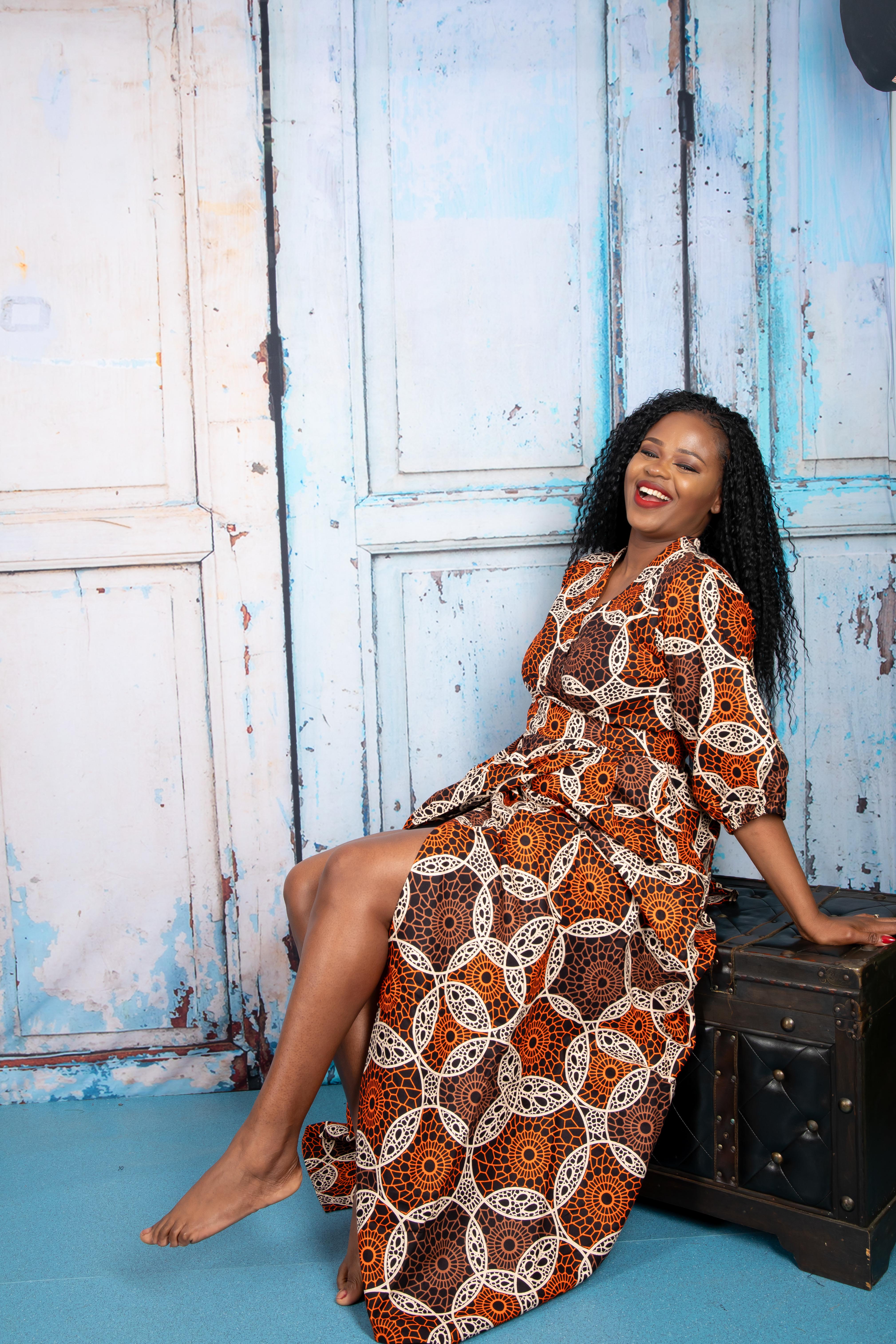 temad collections wrap dress, orange wrap dress, african print wrap dress, brown ankara wrap dress, african print midi dress, orange african print maxi dress, african print floor length dress, african print short sleeves dress, african print wrap maxi dress, ankara green wrap dress, ankara maxi wrap dress, modern african print dress, stylish wrap dress, maxi african print dress, puff sleeves wrap dress, long african print dress, long ankara wrap dress