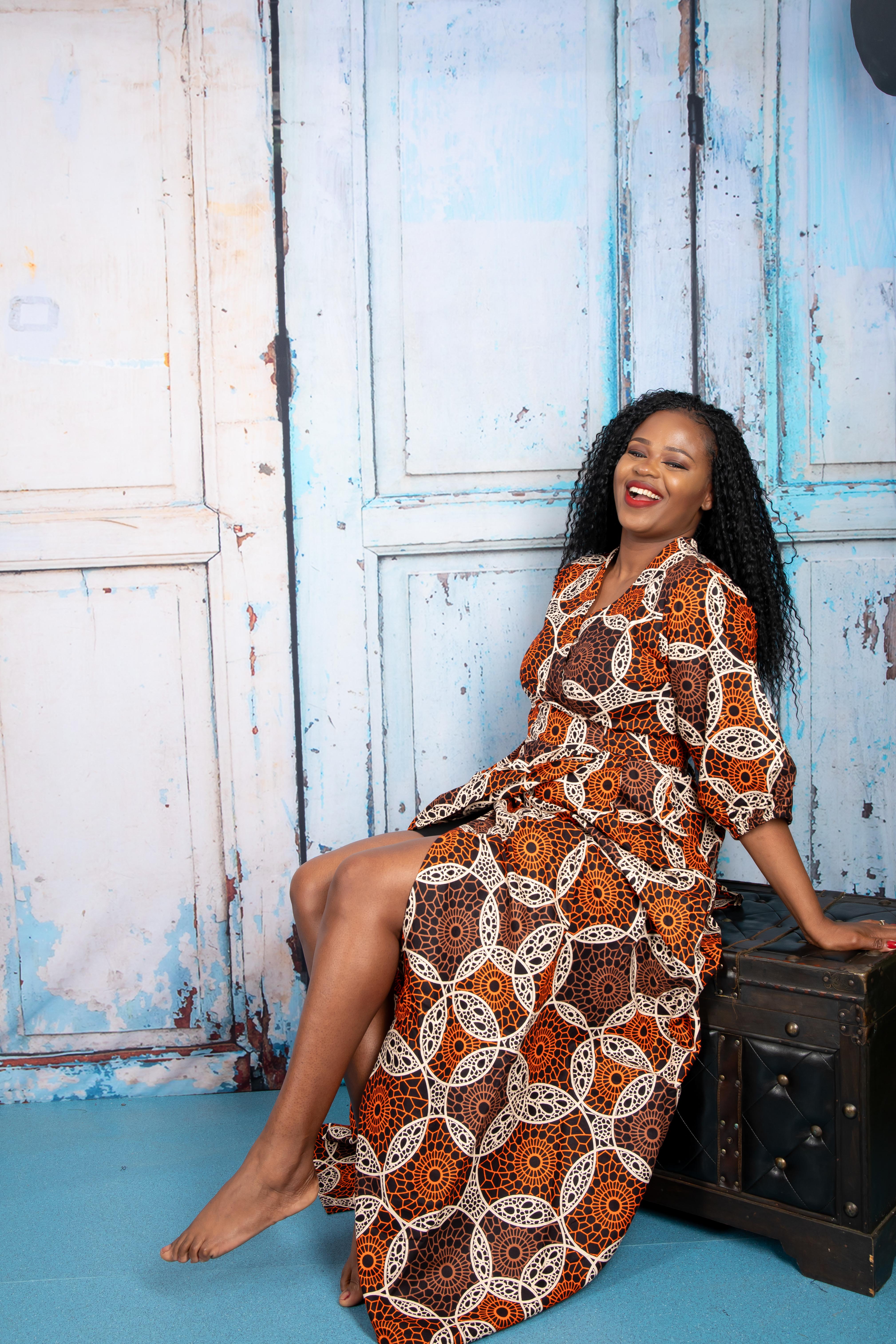 temad collections wrap dress, orange wrap dress, african print wrap dress, brown ankara wrap dress, african print midi dress, orange african print maxi dress, african print floor length dress, african print short sleeves dress, african print wrap maxi dress, ankara green wrap dress, ankara maxi wrap dress, modern african print dress, stylish wrap dress, maxi african print dress, puff sleeves wrap dress, long african print dress, long ankara wrap dress