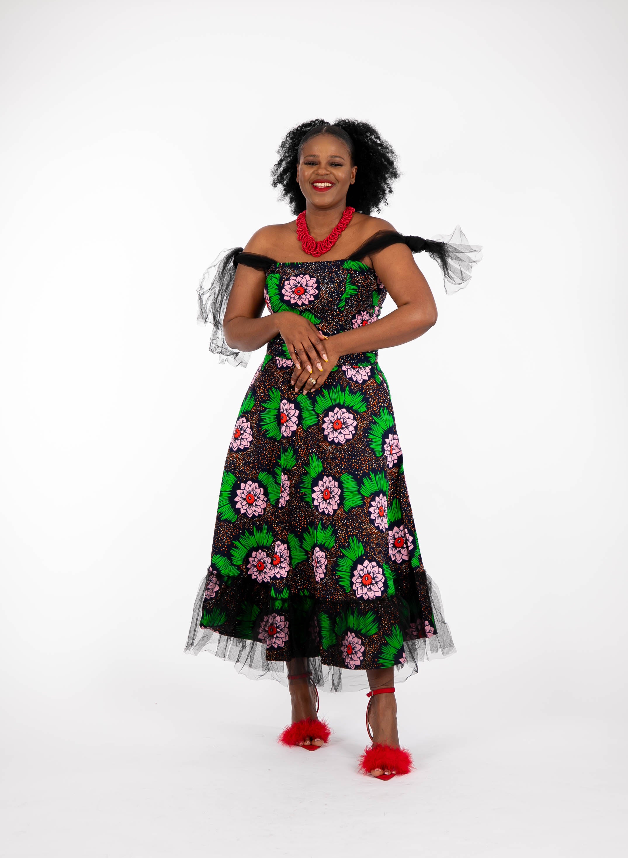 Temad collections Carino  african print ankara tulle circle skirt and crop top, Stylish African print skirts and tops, African print Ankara fabric, African tulle crop top, African crop top , African crop top , African print casual crop top , African crop top for ladies, African flared trousers, Ankara crop top, Ankara top, Ankara crop top, latest Ankara shorts, african floral shorts and tops, stylish african top,  african crop top matching skirt