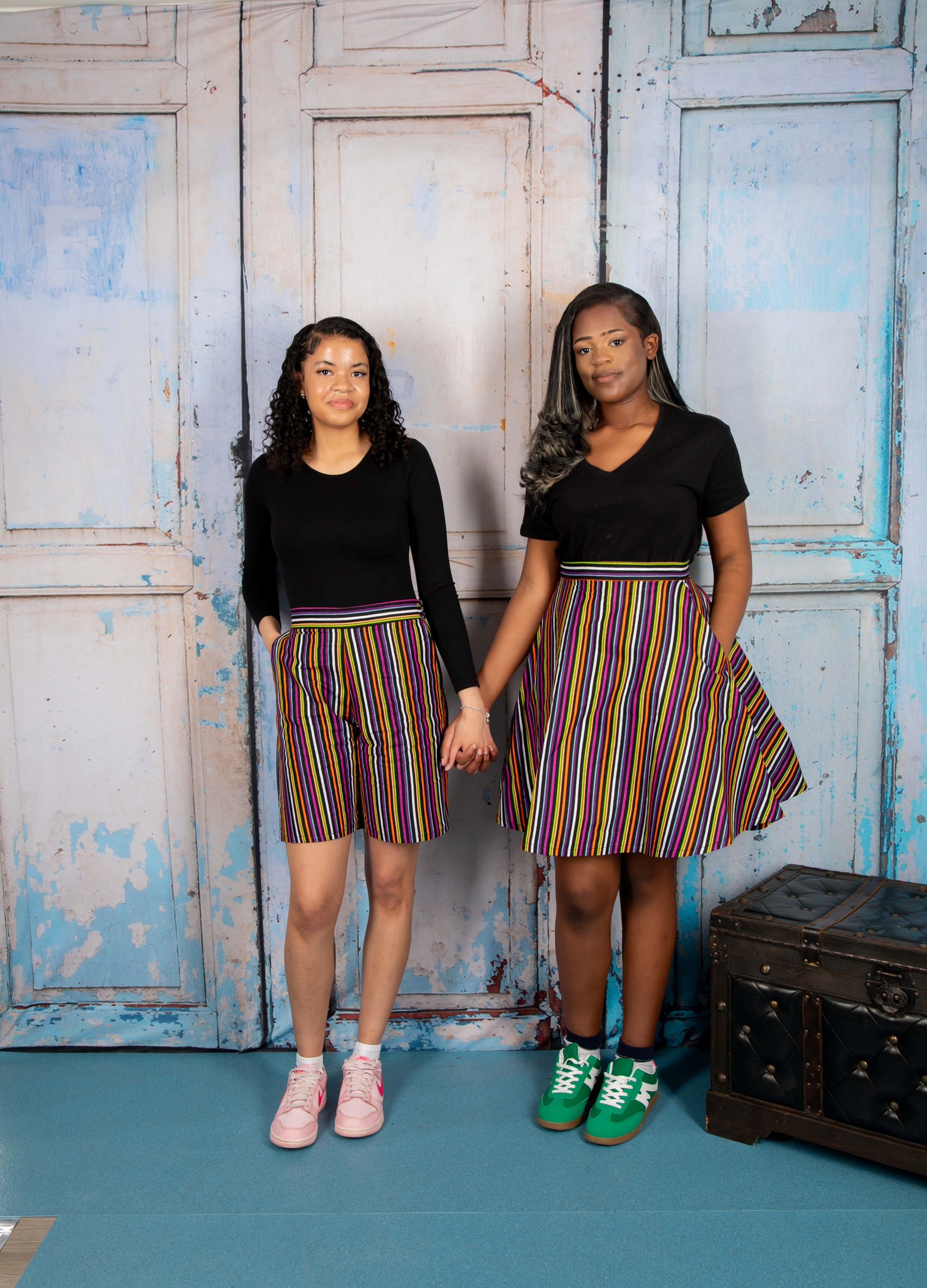 Mini circle skirt with vibrant stripy African print fabric, featuring bold, multicolored horizontal and vertical stripes. Chic mini circle skirt in bold, stripy African print—featuring vibrant multicolor patterns and a playful, flared silhouette perfect for standout styling