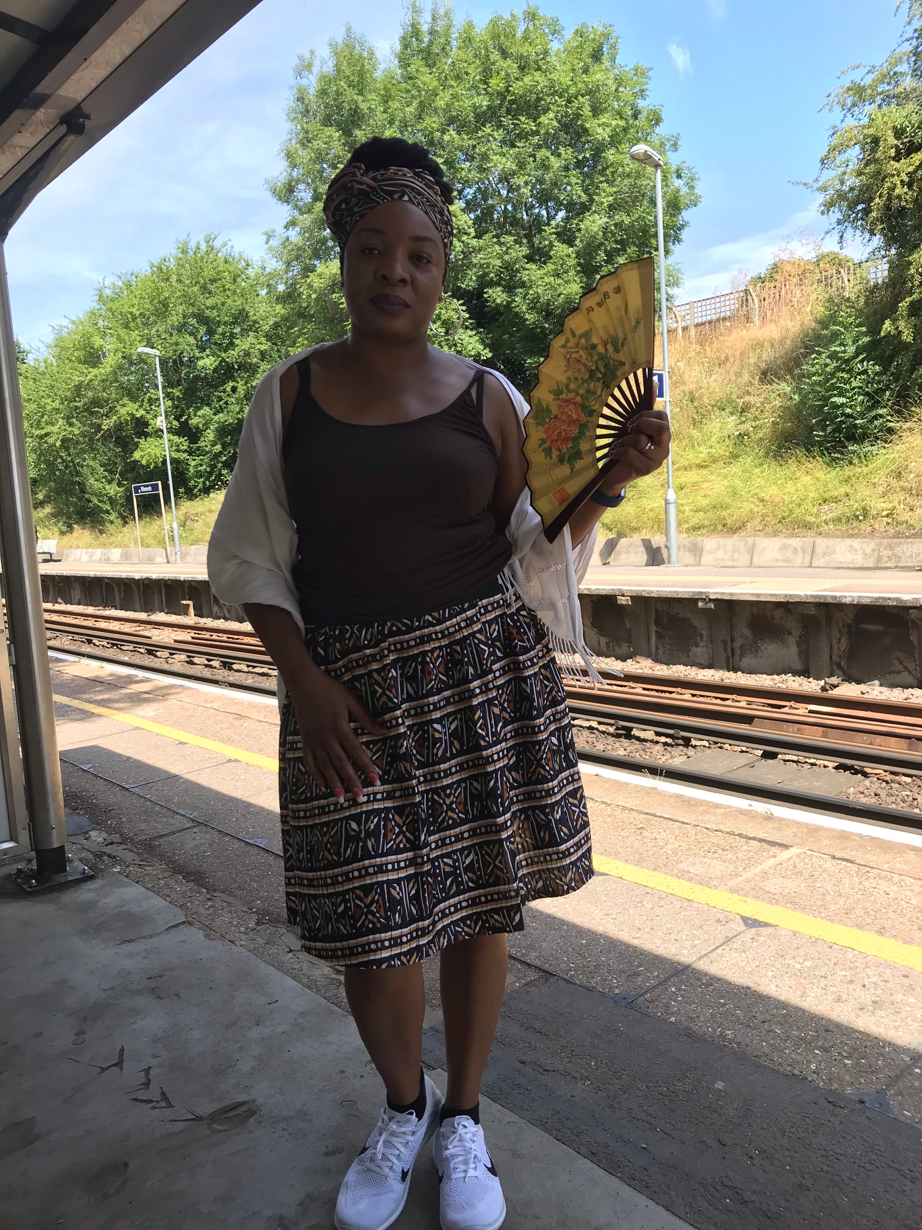 Temad collections Ankara brown silk pleated mini skirt with pockets and elasticated band