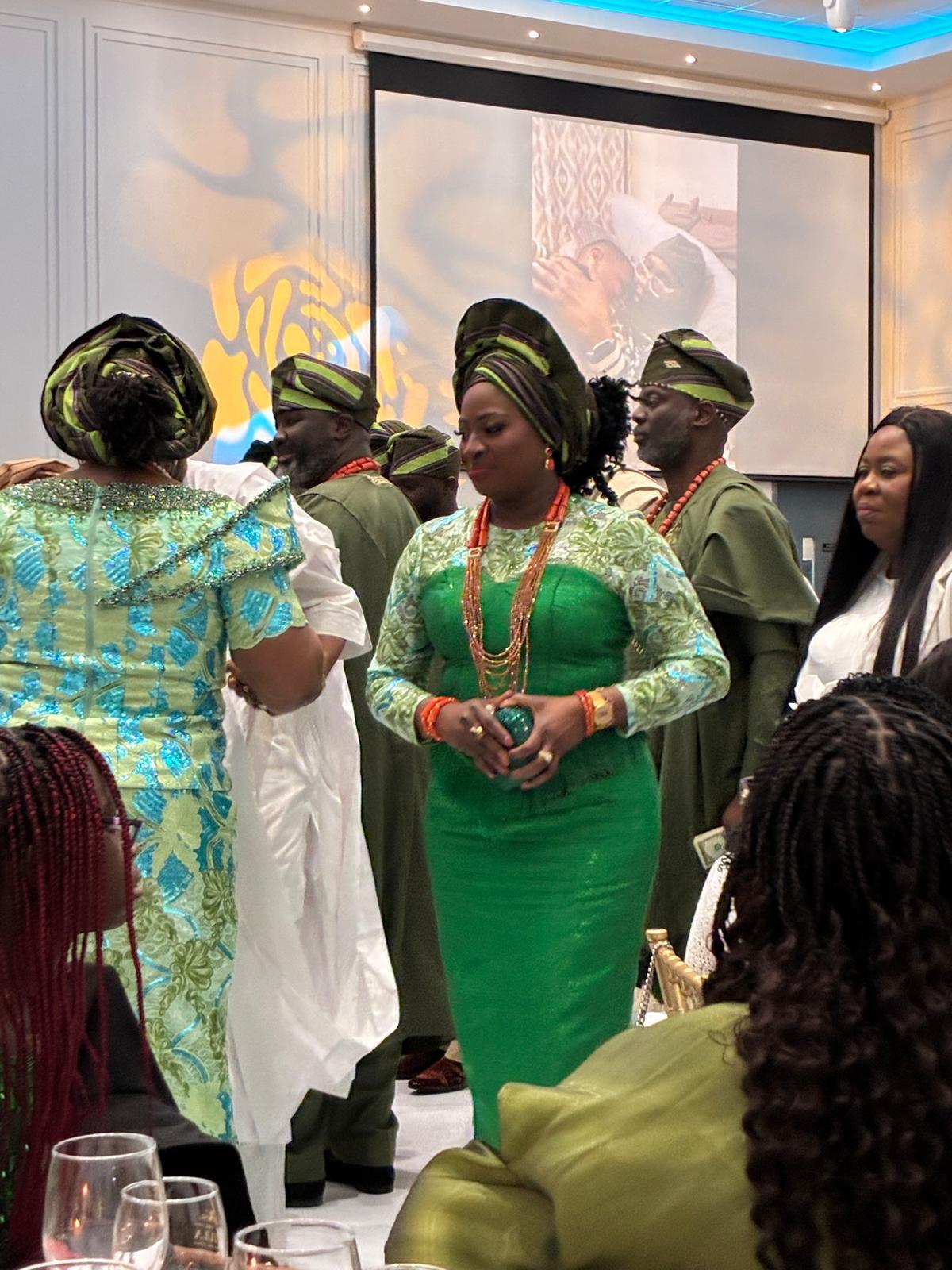 temad woman in bespoke green aso oke / lace combo