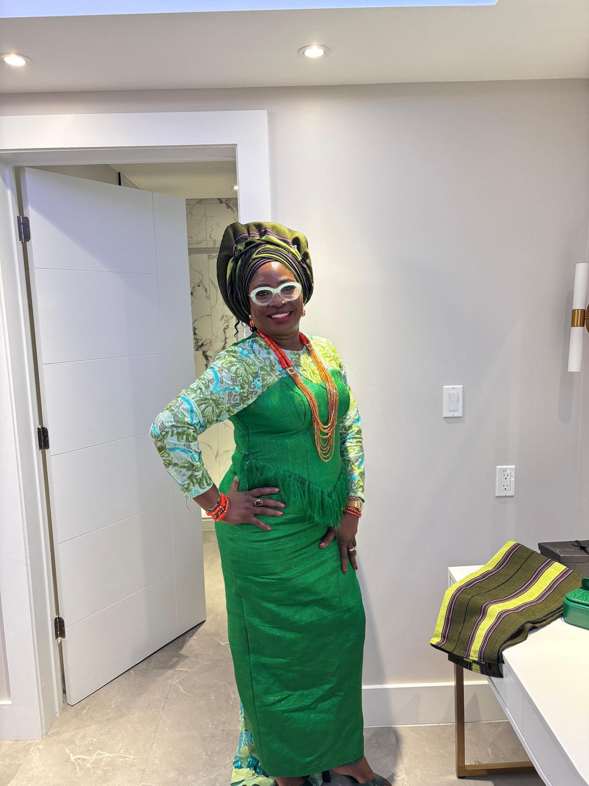 temad woman in bespoke green aso oke / lace combo